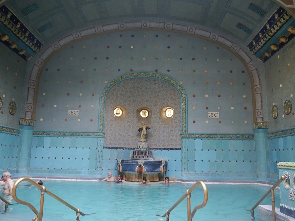 Inside Gellért Thermal Bath in Budapest with locals relaxing in the warm mineral pool