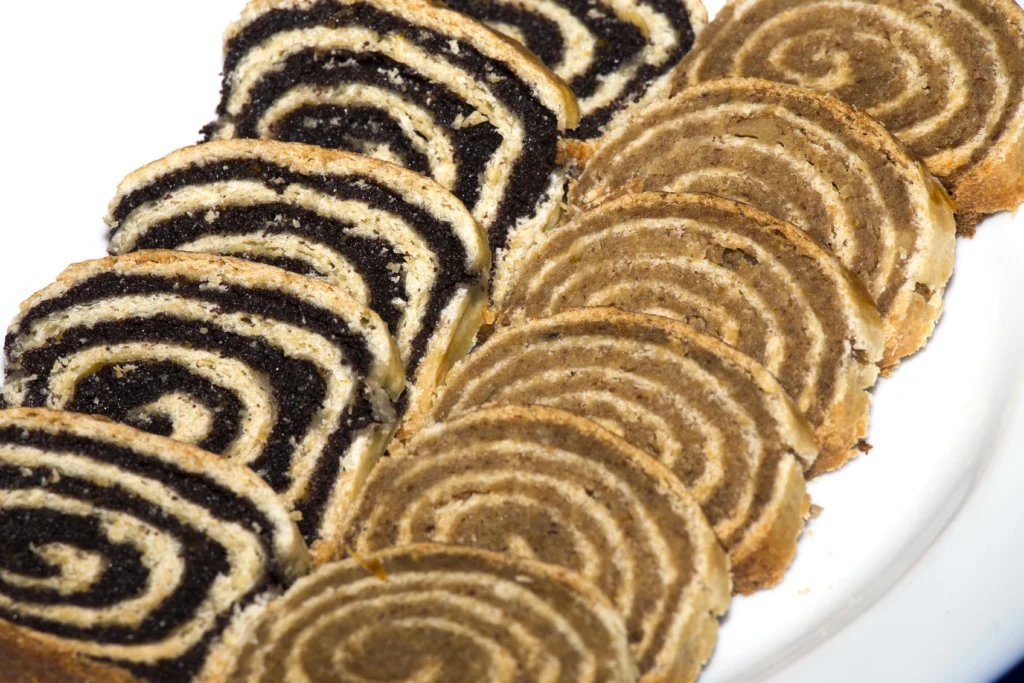 Hungarian Bejgli slices with walnut and poppy seed filling — traditional yeast pastry roll popular in Hungary for Christmas and Easter.
