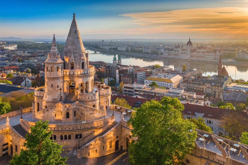 Fisherman’s Bastion in Budapest at sunrise, with its white towers overlooking the Danube and Parliament, offering one of the most iconic panoramic views in Hungary
